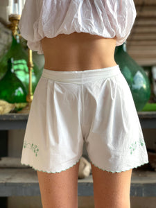 Vintage shorts lined with embroidered flowers.